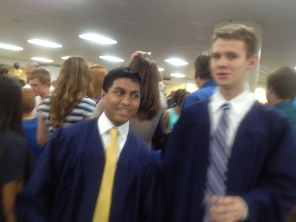 Alex after graduation with his friend Earl.